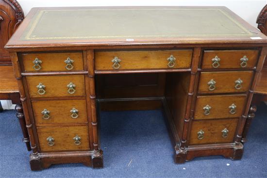 A Victorian Gothic Revival mahogany pedestal desk W.122cm